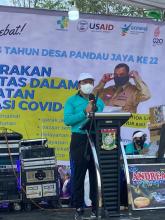 Penggerakan Komunitas Dalam Percepatan Vaksinasi Covid-19 yang dilaksanakan di Desa Pandau Jaya, Siak Hulu - Kabupaten Kampar.